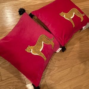 Two chinoiserie pompom cheetah pillows